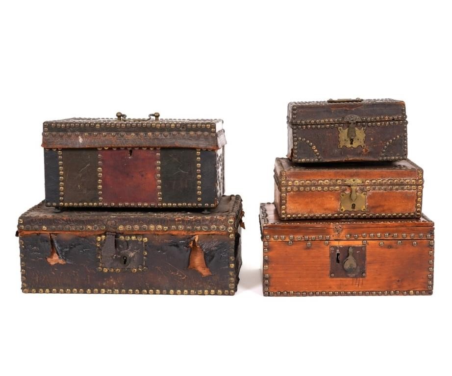 Five leather studded storage boxes.
5.5"h