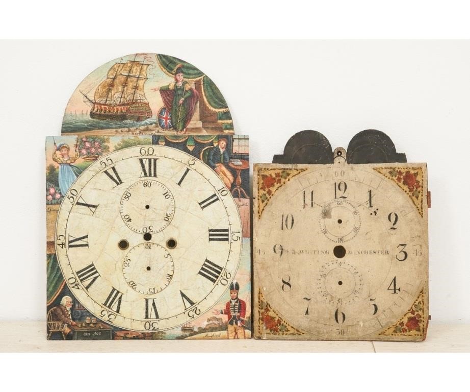 Two clock dials the largest a painted