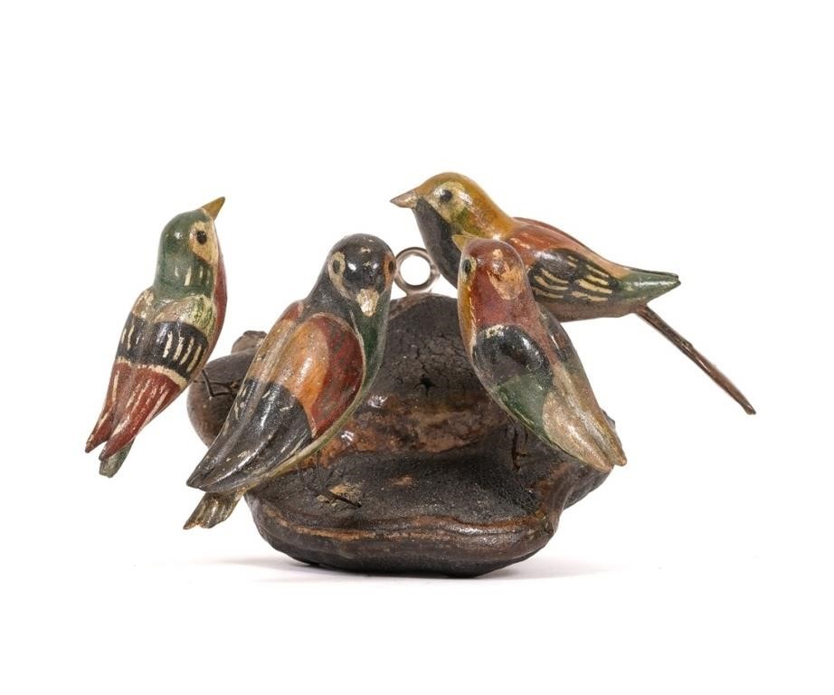 Four carved and painted birds mounted