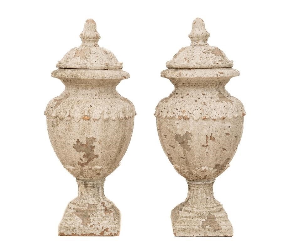 Pair of terra cotta covered urns