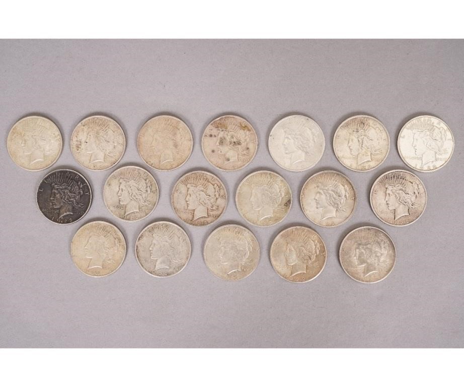 Eighteen 1922 silver Peace Dollars.
Condition: