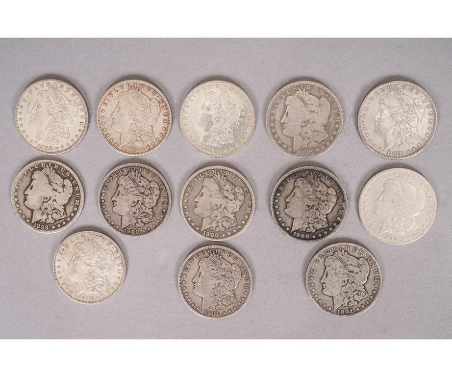 Thirteen Morgan silver dollars