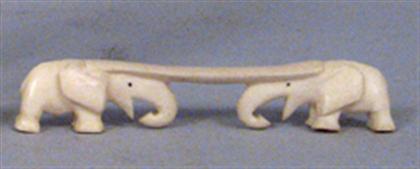 Carved ivory figural knife rest with