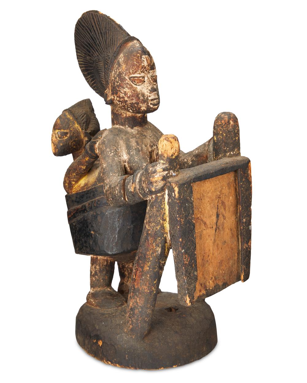 A YORUBA CARVED WOOD MATERNITY