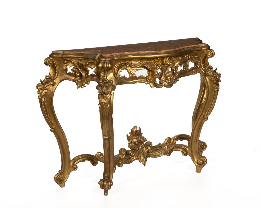 AN ITALIAN CARVED GILTWOOD CONSOLE