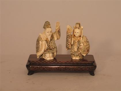 Two Carved Ivory Figures Holding 4b10c
