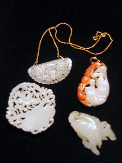 Four Chinese white jade pendants 4b186