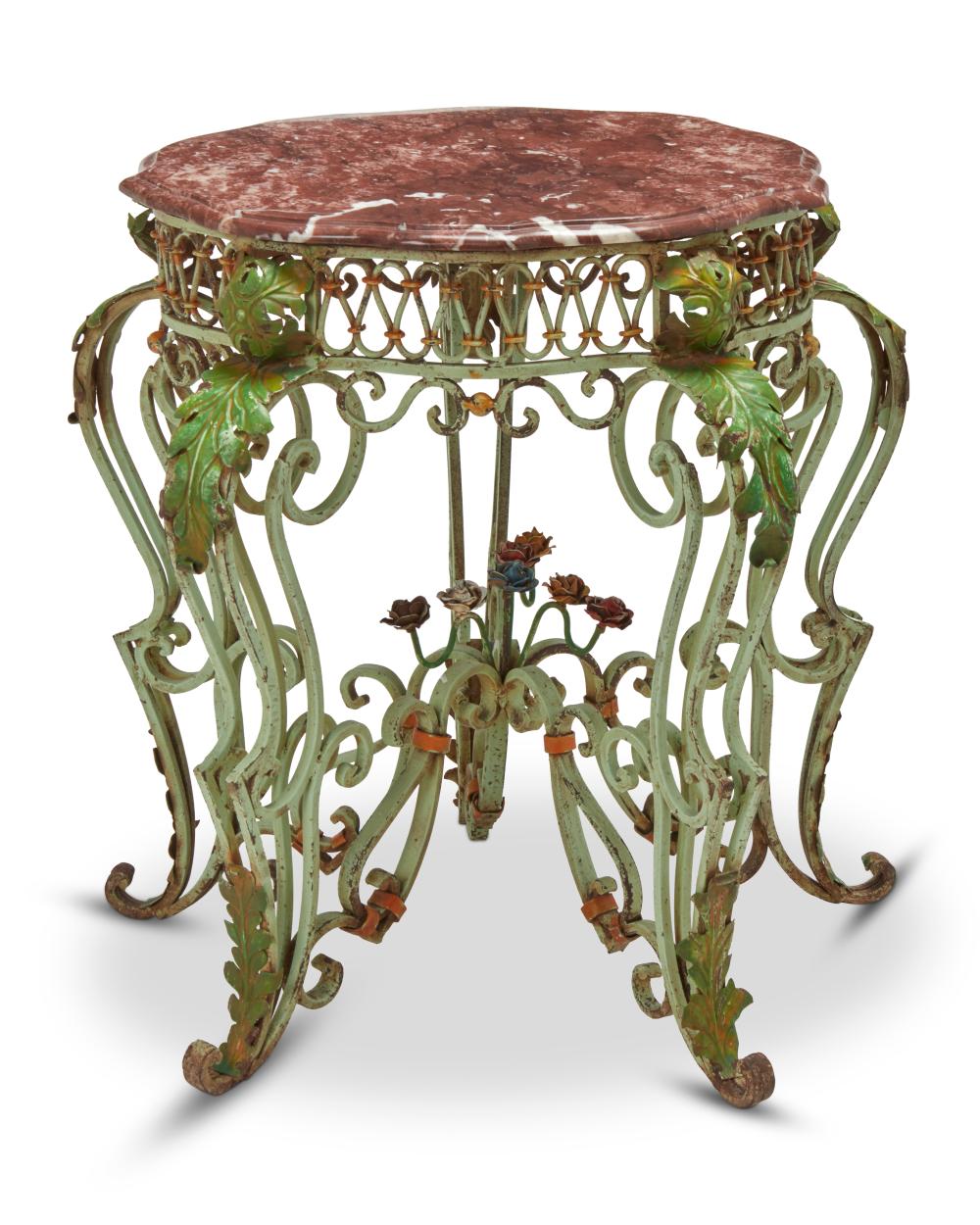 A WROUGHT IRON TABLE WITH MARBLE