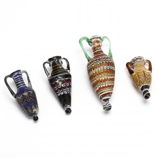 FOUR PHOENICIAN STYLE CORE GLASS AMPHORISKOI