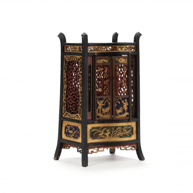 A CHINESE PAINTED AND GILDED CARVED