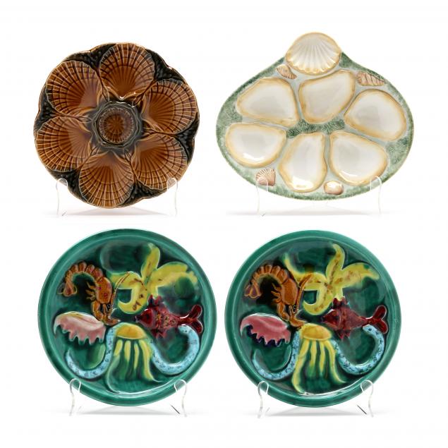 FOUR VINTAGE MAJOLICA OYSTER PLATES