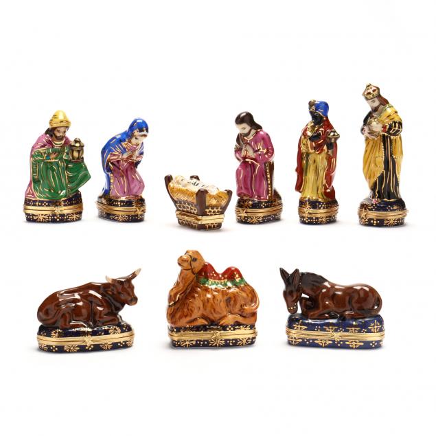 A NINE PIECE LIMOGES PORCELAIN NATIVITY