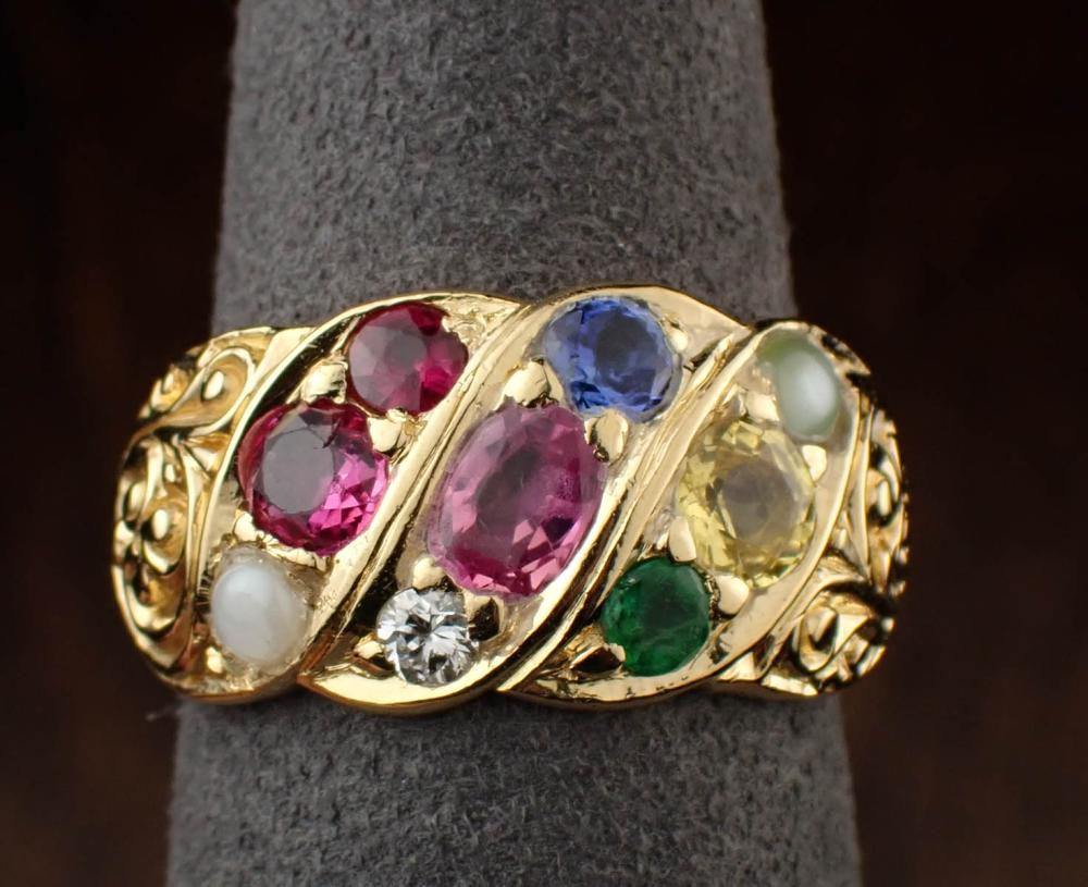 EIGHTEEN KARAT GOLD RING WITH GEMSTONESEIGHTEEN