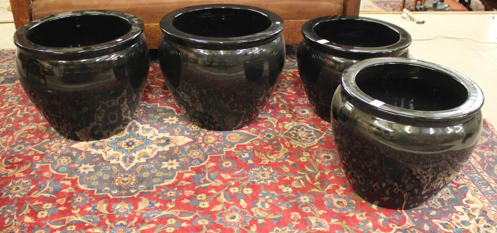 A SET OF FOUR BLACK PORCELAIN FLOOR