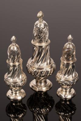 A set of George II silver casters,