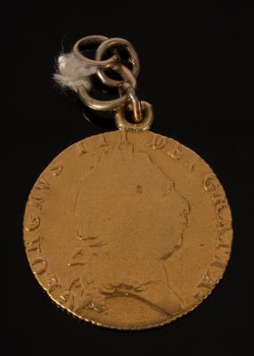 A George III gold spade guinea,