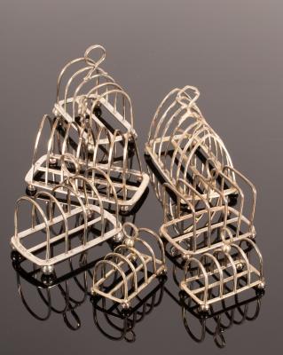 Three pairs of silver toast racks, Victorian
