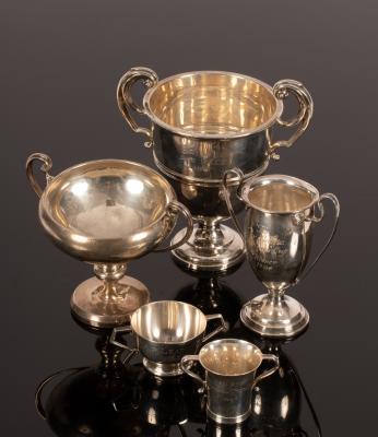 A small group of silver trophies,