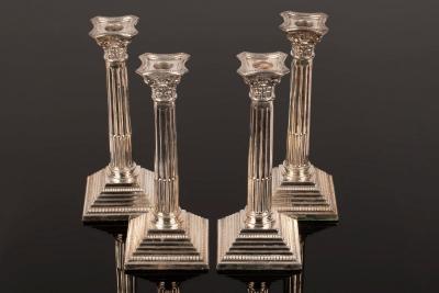 A set of four silver candlesticks,