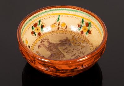 A small glazed bowl, the interior decorated