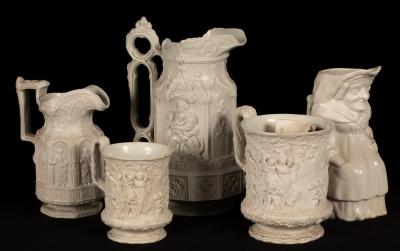 Five saltware jugs, decorated figures