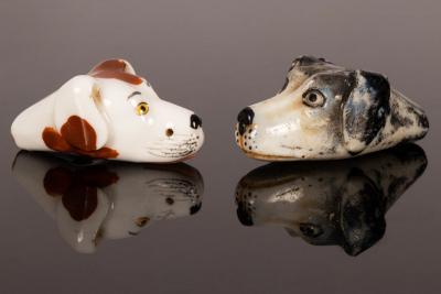 A pair of Staffordshire dogs head whistles,