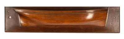 A carved and moulded fruitwood half-hull,