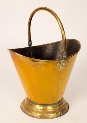 A brass helmet-shaped coal scuttle,