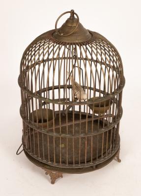 A wirework bird cage of cylindrical
