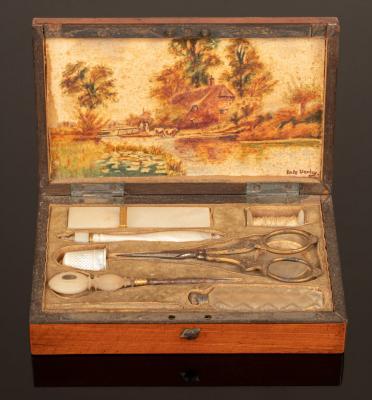 A Palais Royal sewing set contained