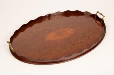 An Edwardian inlaid oval tray with brass