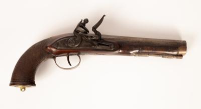 A flintlock duelling pistol with a chequered