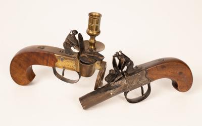 A small flintlock pocket pistol  2ee2f7