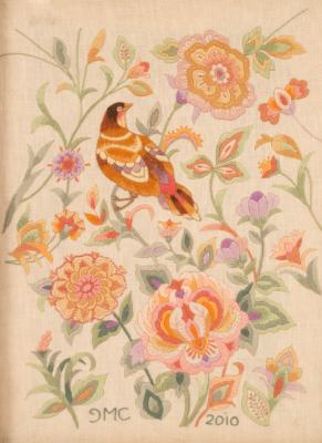 A crewel work picture depicting a bird