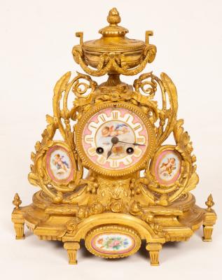 A gilt metal mounted mantel clock,