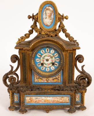 A gilt metal and porcelain mantel clock,