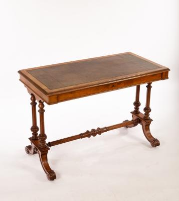 A Victorian walnut writing table