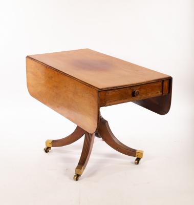 A late Regency mahogany two-flap table,