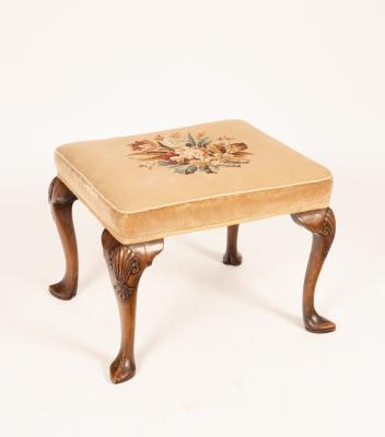 A walnut stool with upholstered