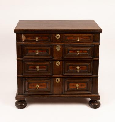 A Jacobean style oak chest of four