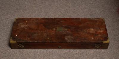 A brass bound mahogany gun case with