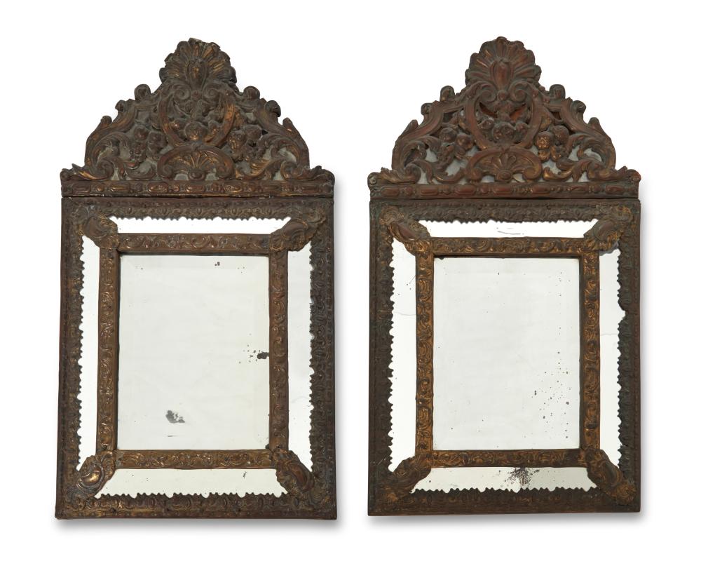 A PAIR OF REPOUSSE BRASS WALL MIRRORSA