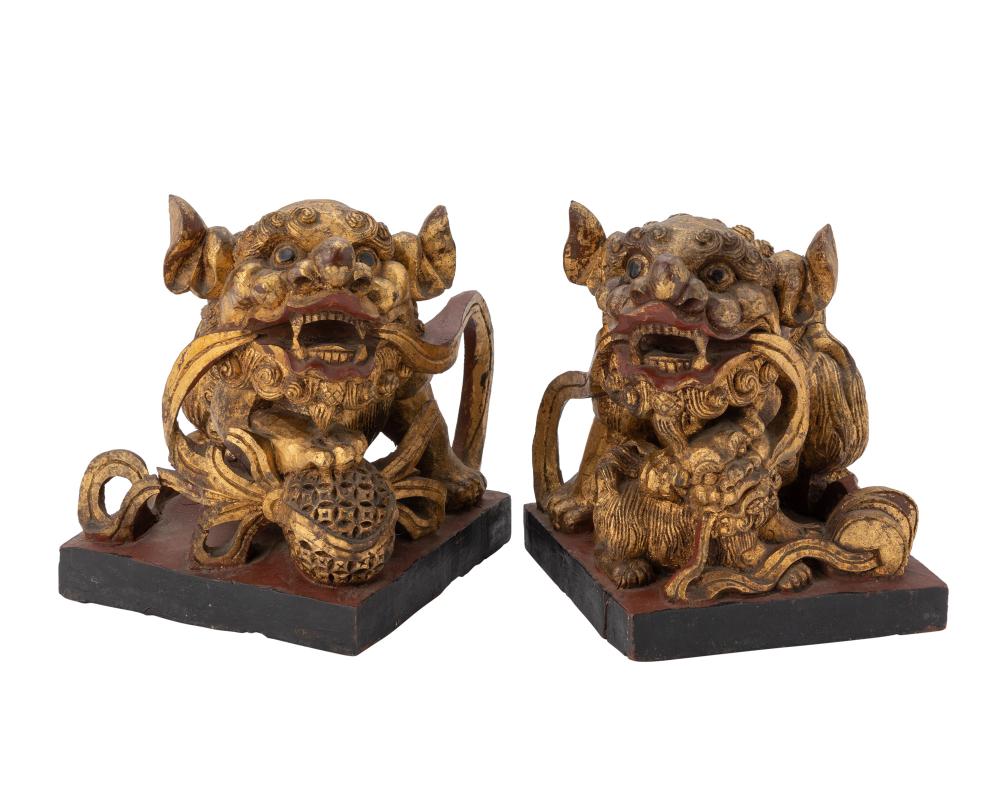 A PAIR OF CHINESE CARVED GILTWOOD GUARDIAN