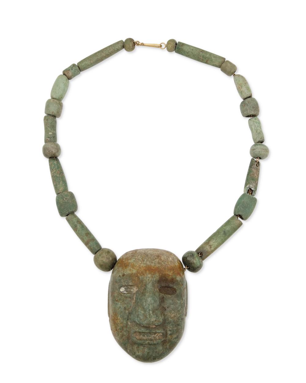 A CARVED GREENSTONE MASK NECKLACEA 2ee648