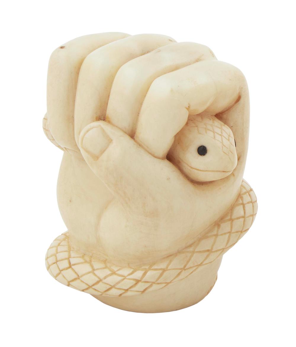 WHALE IVORY CARVING OF A FIST CLENCHING