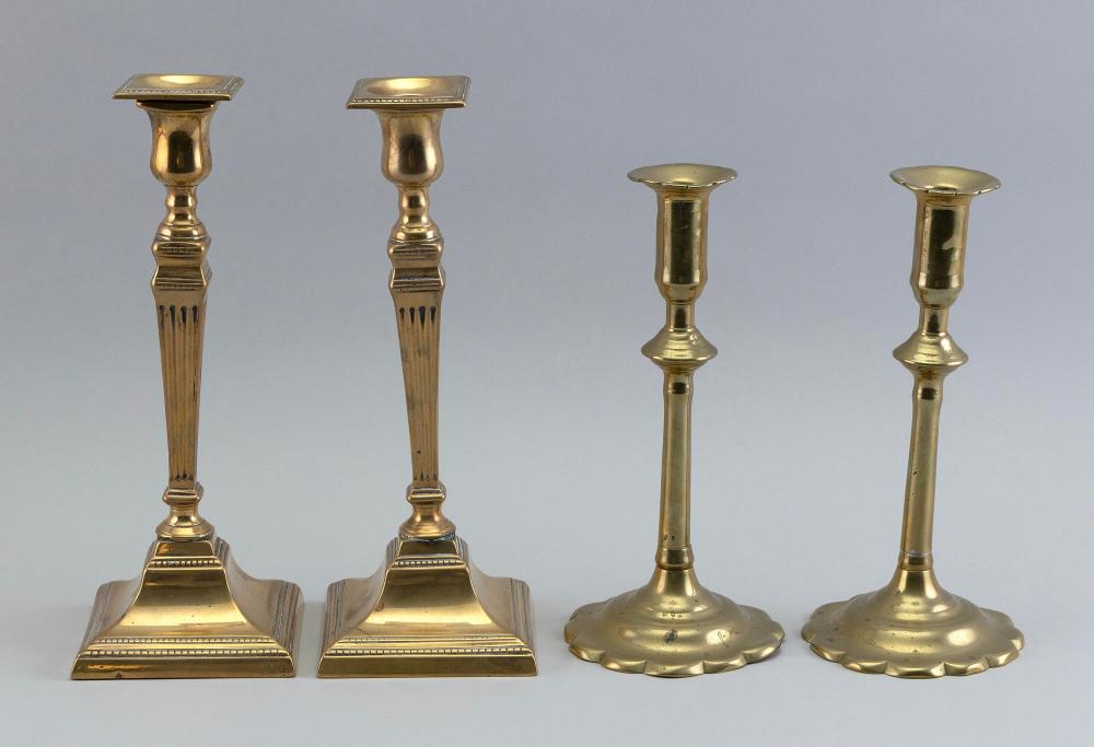 TWO PAIRS OF BRASS CANDLESTICKS