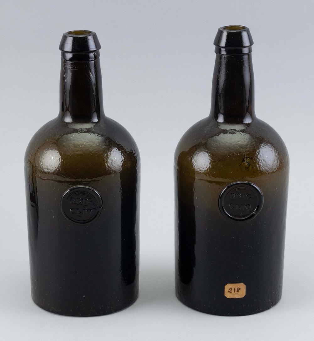 TWO APPLIED LABEL BOTTLES LATE