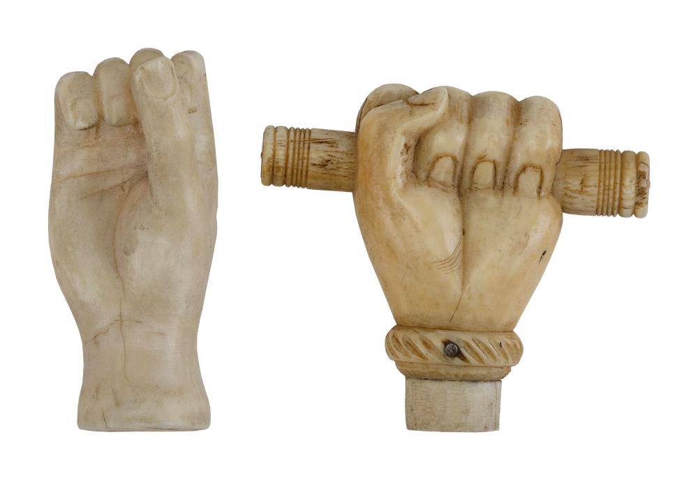 TWO CLENCHED FIST CARVINGS SECOND