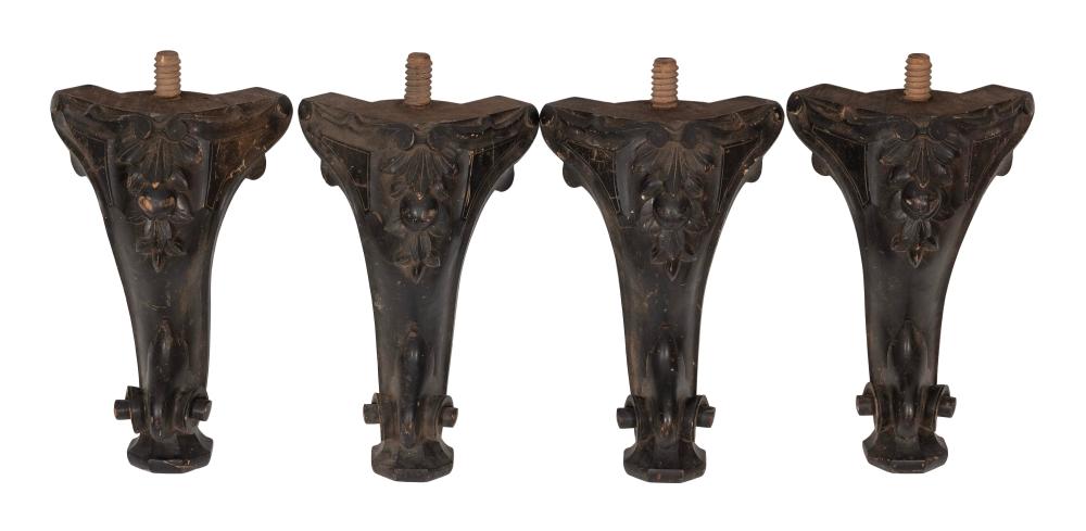 FOUR CARVED AND EBONIZED WOODEN