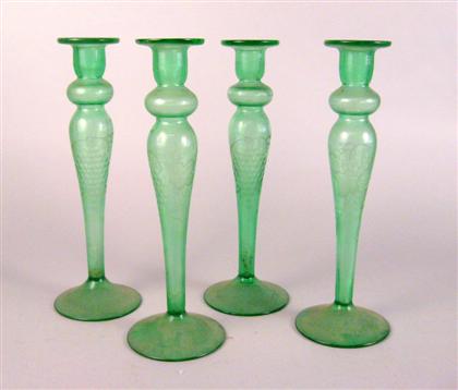 A set of four green glass candlesticks 4b6c9